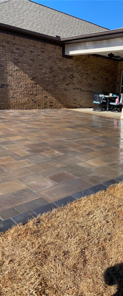 Covered paver patio by PHES Landscaping
