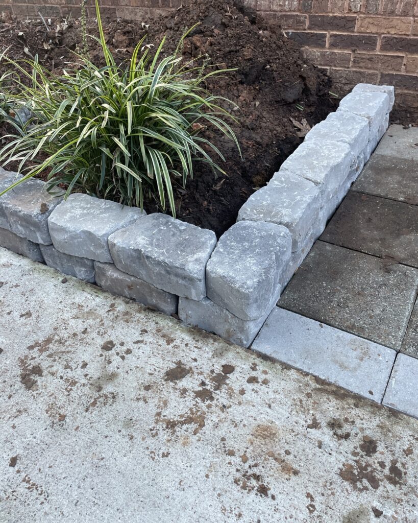 Stacked stone border by PHES Landscaping